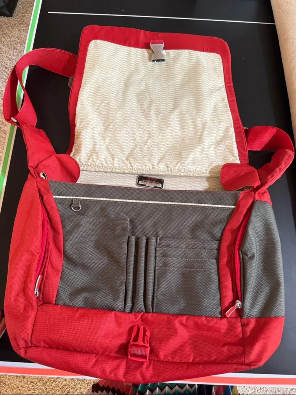 Tumi Red Messenger Bag with Gray Accent. Expandable. Laptop section.